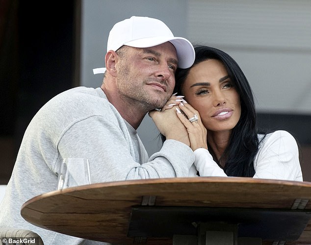 The couple enjoyed champagne in the sunshine and could not keep their hands off each other before later enjoying a stroll