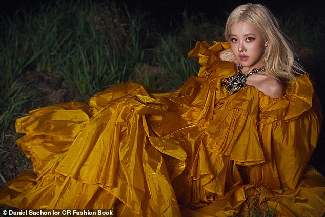 For her next look, the star slipped into a gold ruffled off-the-shoulder gown and accessorised with a silver statement necklace