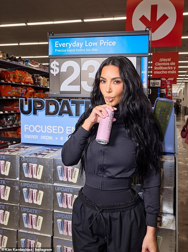 She also shared a photo of herself sipping from one of the energy drink cans as she stood next to the colorful display