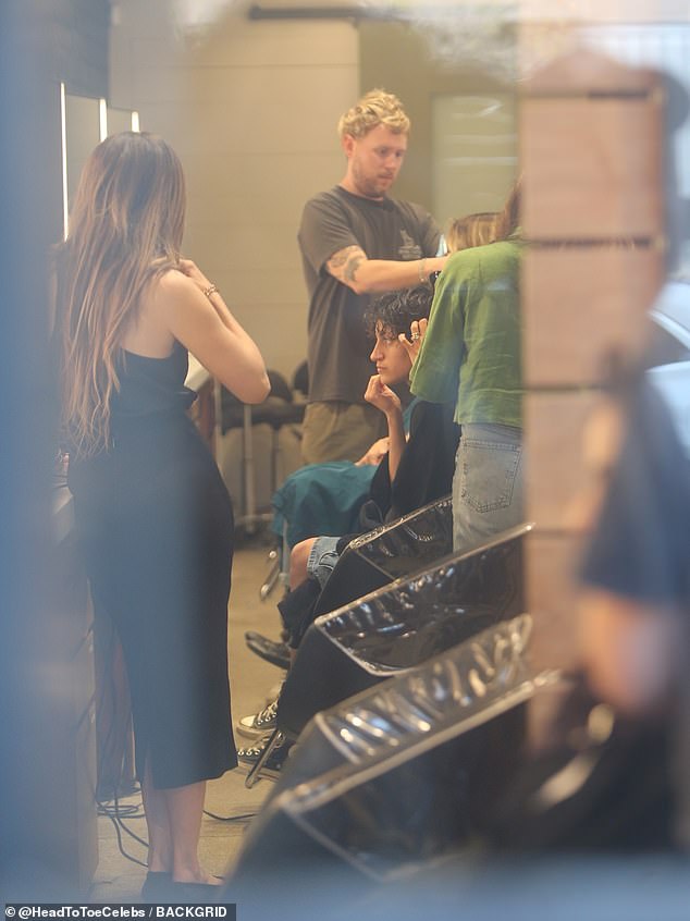 Multiple stylists attended to the teen's texture jet black hair at the shop, where haircuts range from $285 with a master stylist to $900 with salon owner Christophe Schatteman