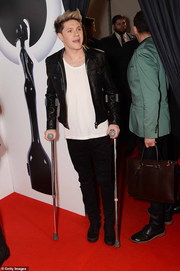The former One Direction singer, 32, was forced to go undergo reconstructive surgery on his knee in 2014 (pictured in 2014 at the BRIT Awards)