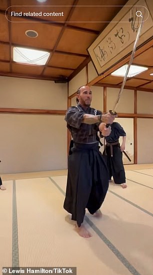 He 'battled' two sword-wielding assistants