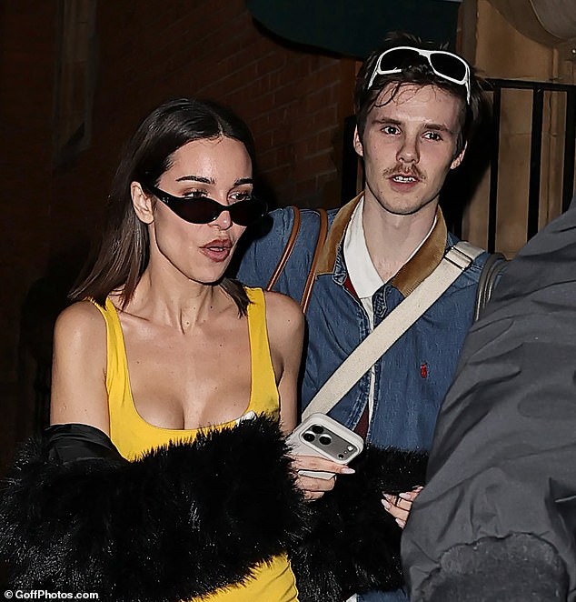 Cruz seemed in good spirits as he departed his latest show, flanked by his girlfriend Jackie, 30, who put on a busty display in a skintight yellow dress