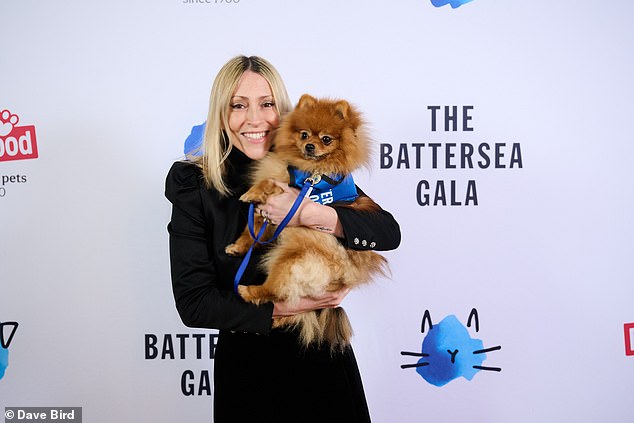 Nicole Appleton with Battersea rescue dog Nemo on the blue carpet