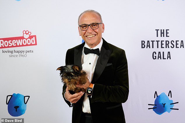 Theo Paphitis with Battersea rescue dog Hazel on the blue carpet at Battersea Dogs & Cats Home's 2026 Gala Dinner