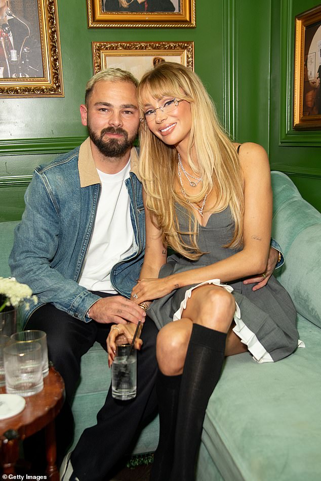 For the past three years, the couple have kept up the illusion on podcasts and television shows they are husband and wife. Pictured together last year