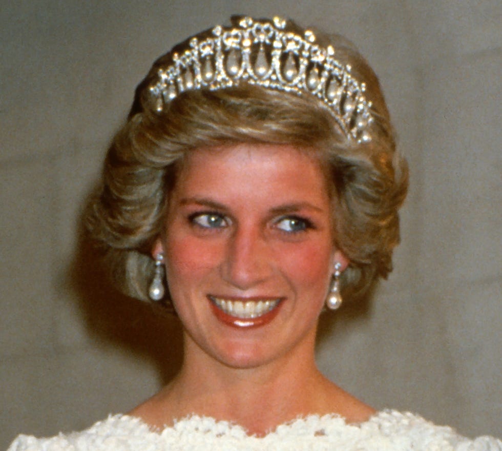 washington, dc november 11: diana, princess of wales, wearing a cream lace gown with a scalloped neckline designed by murray arbeid and the cambridge lover's knot diamond and pearl tiara, smiles as she attends a dinner at the british ambassador's residence on november 11, 1985 in washington, dc. (photo by anwar hussein/getty images)