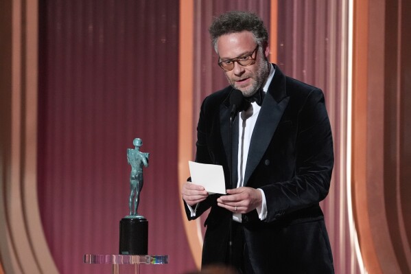 Seth Rogen accepts the award for outstanding performance by a female actor in a comedy series for "The Studio" on behalf of Catherine O'Hara during the 32nd Annual Actor Awards on Sunday, March 1, 2026, at the Shrine Auditorium and Expo Hall in Los Angeles. (AP Photo/Chris Pizzello)