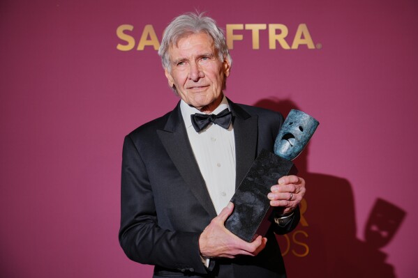 Harrison Ford poses in the press room with the lifetime achievement award during the 32nd Annual Actor Awards on Sunday, March 1, 2026, at the Shrine Auditorium and Expo Hall in Los Angeles. (Photo by Jordan Strauss/Invision/AP)