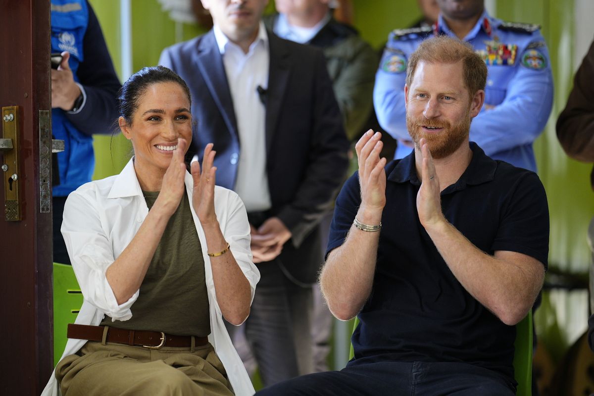 The Duke and Duchess of Sussex listen to a music performance during a visit to the QuestScope Youth Center at the Za'atari refugee camp, home to displaced Syrians, near Mafraq in northern Jordan