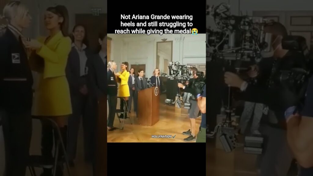Not Ariana Grande wearing heels and still struggling to reach while giving the medal ðŸ˜#arianagrande Not Ariana Grande wearing heels and still struggling to reach while giving the medal ðŸ˜#arianagrande