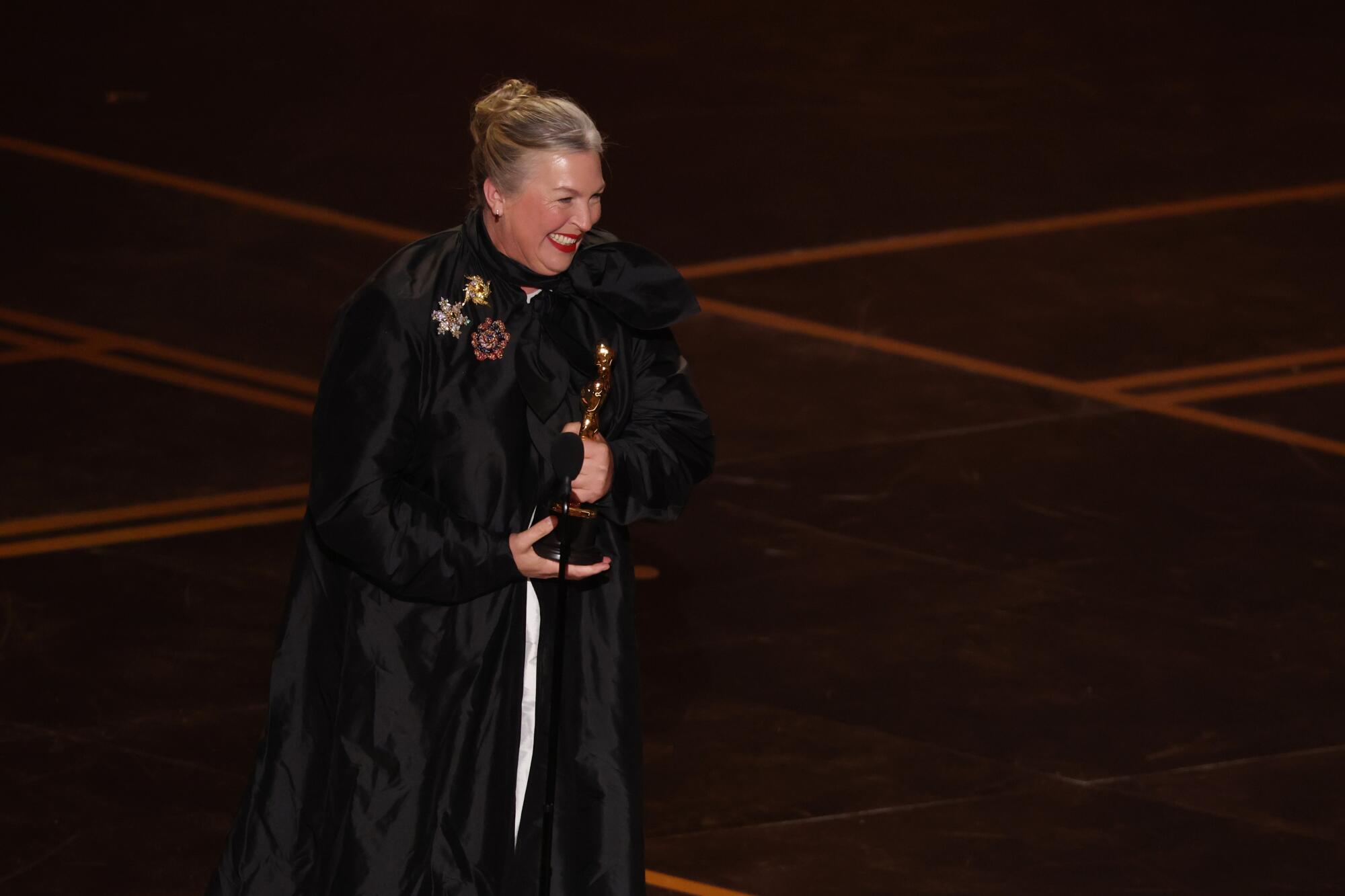 Kate Hawley accepts the Oscar for costume design during the 98th Annual Academy Awards.