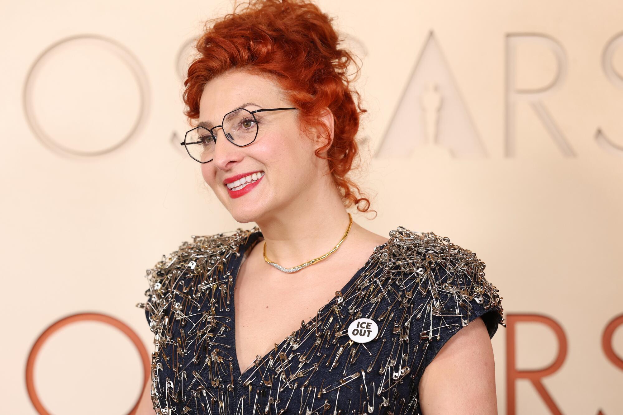 Malgosia Turzanska has a dress covered in safety pins and an ICE out button