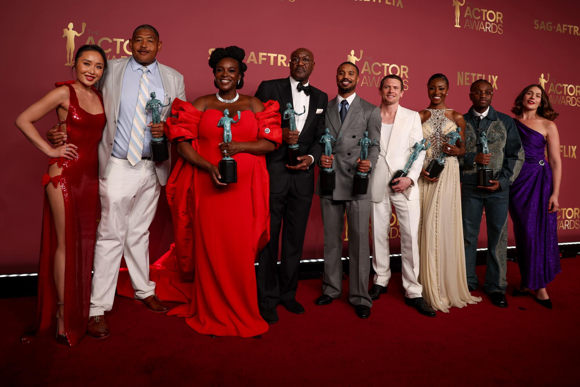 The cast of "Sinners" with their Actor Awards for motion picture ensemble.