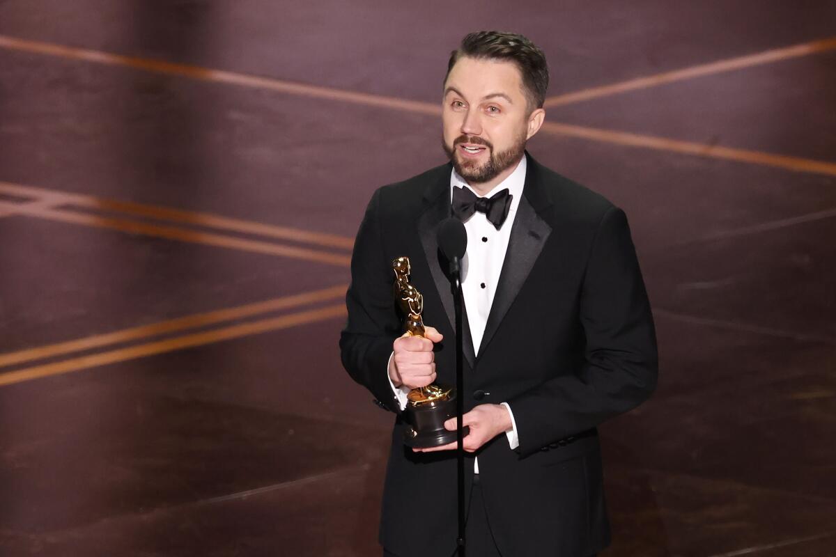 Andy Jurgensen accepts the Oscar for film editing for "One Battle After Another" during the 98th Academy Awards.