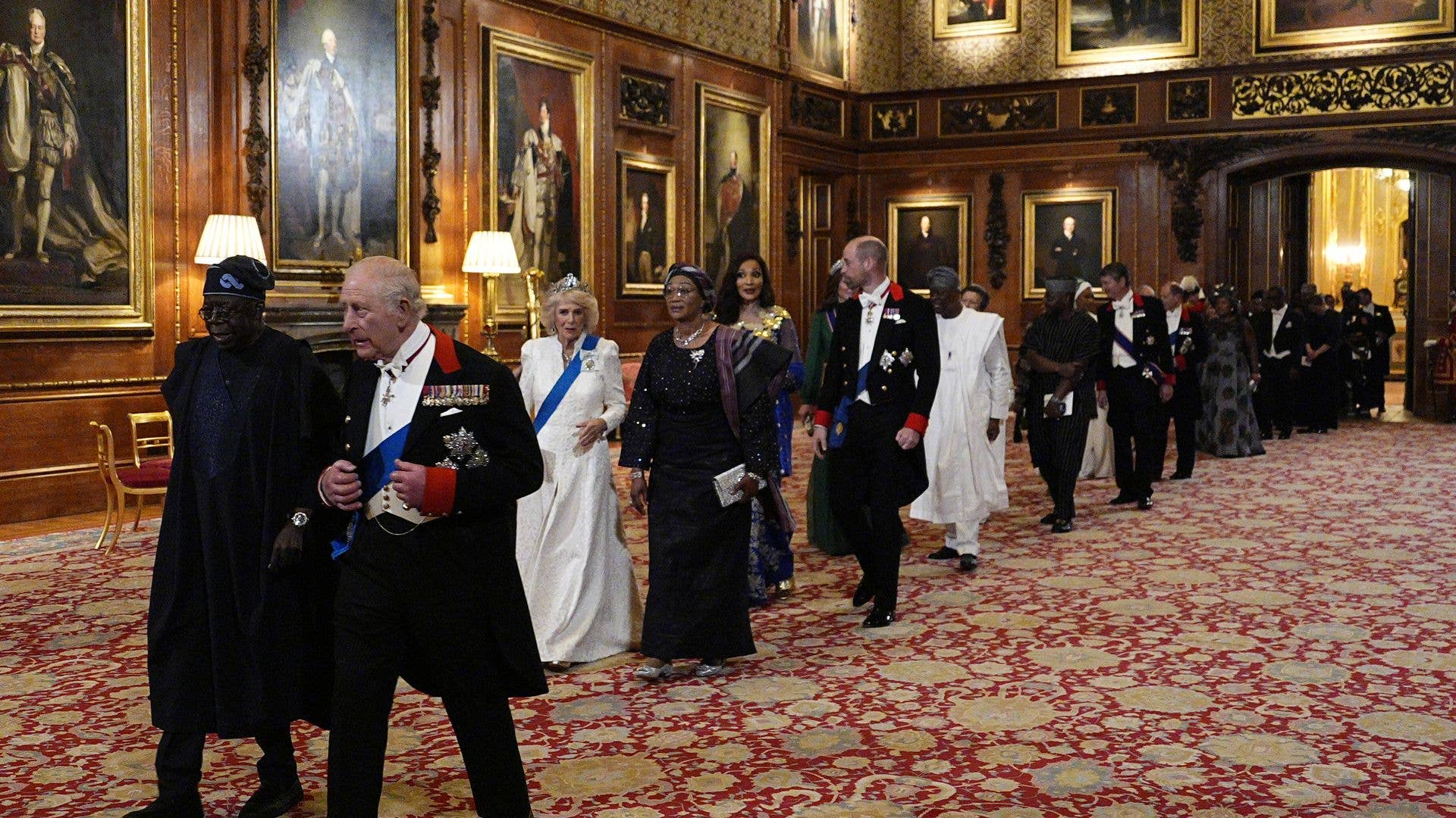 Royals and others walking in a line