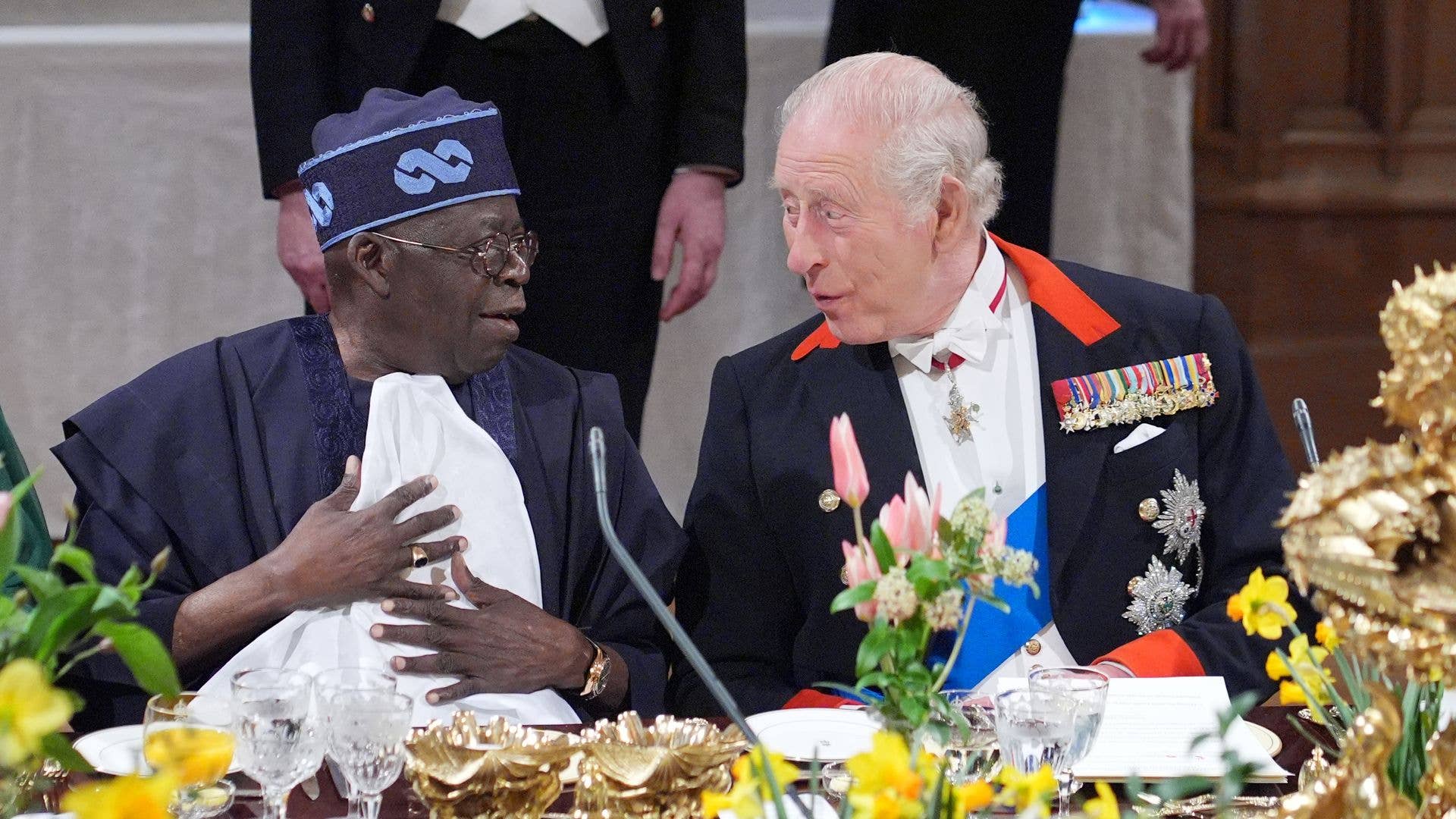 Bola Ahmed Tinubu and King Charles talking at a State Banquet