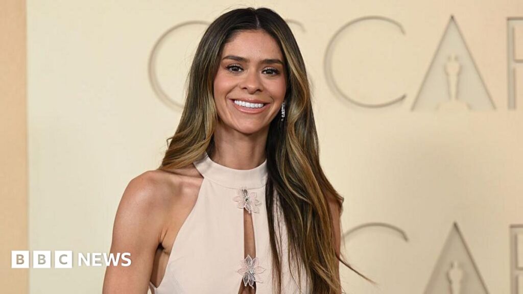 Tiktok star Taylor Frankie Paul attends the 98th Oscars on 15 March in a cream gown.