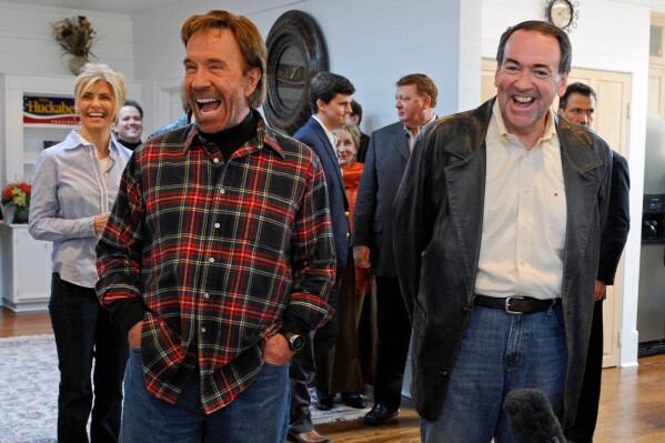 Republican presidential hopeful, former Arkansas Gov. Mike Huckabee, right, appears with actor Chuck Norris on Jan. 20, 2008 in Navasota, Texas. (AP Photo/Pat Sullivan, File)