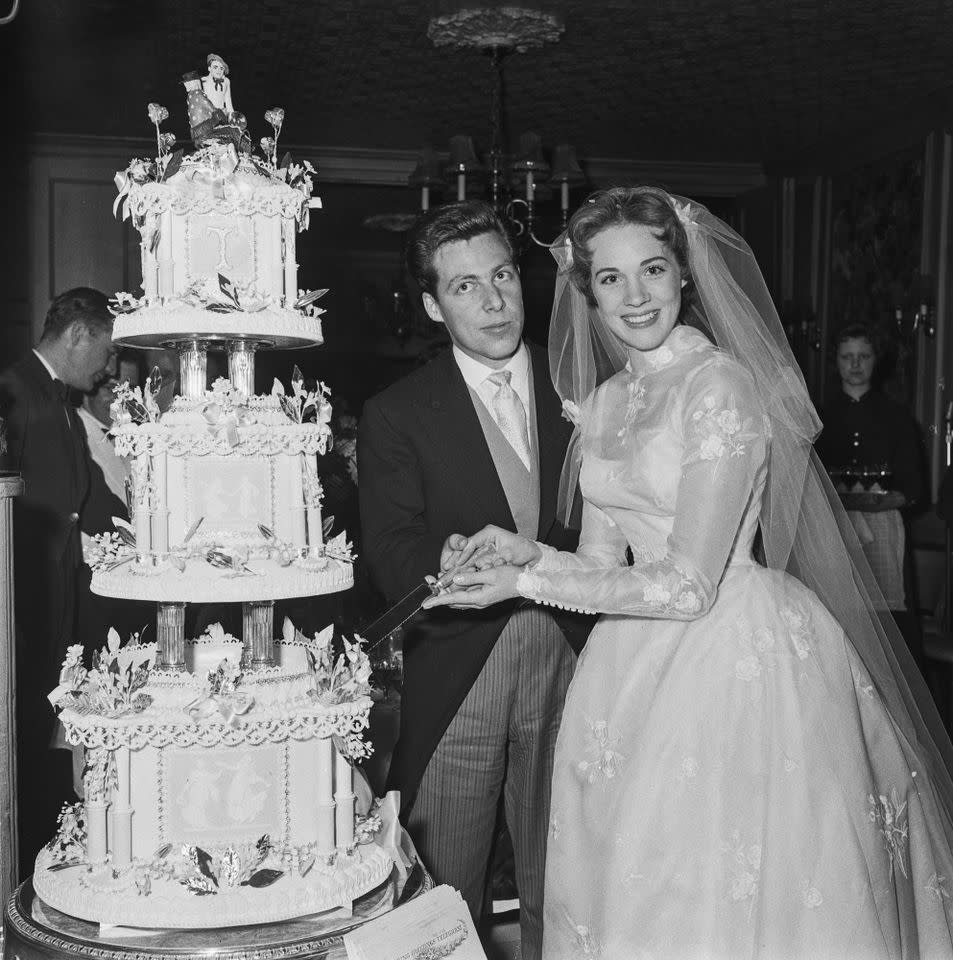 Tony Walton and Julie Andrews cut the cake at their wedding in Weybridge, Surrey, on May 10, 1959Credit: Evening Standard/Hulton Archive/Getty
