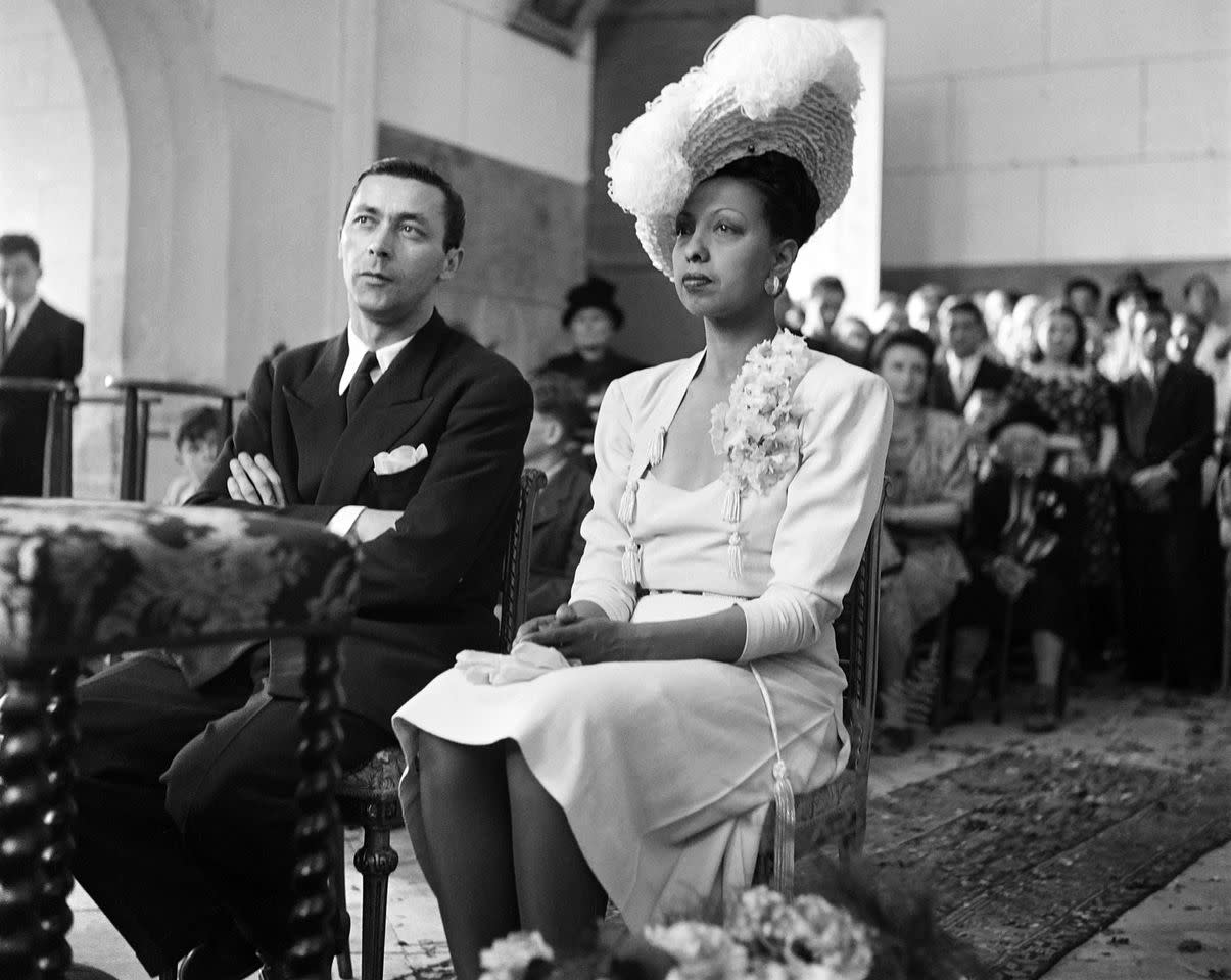 Jo Bouillon and Josephine Baker sit during their wedding mass in the chapel of the Le Château et jardins des Milandes in France on June 3, 1947Credit: AFP via Getty