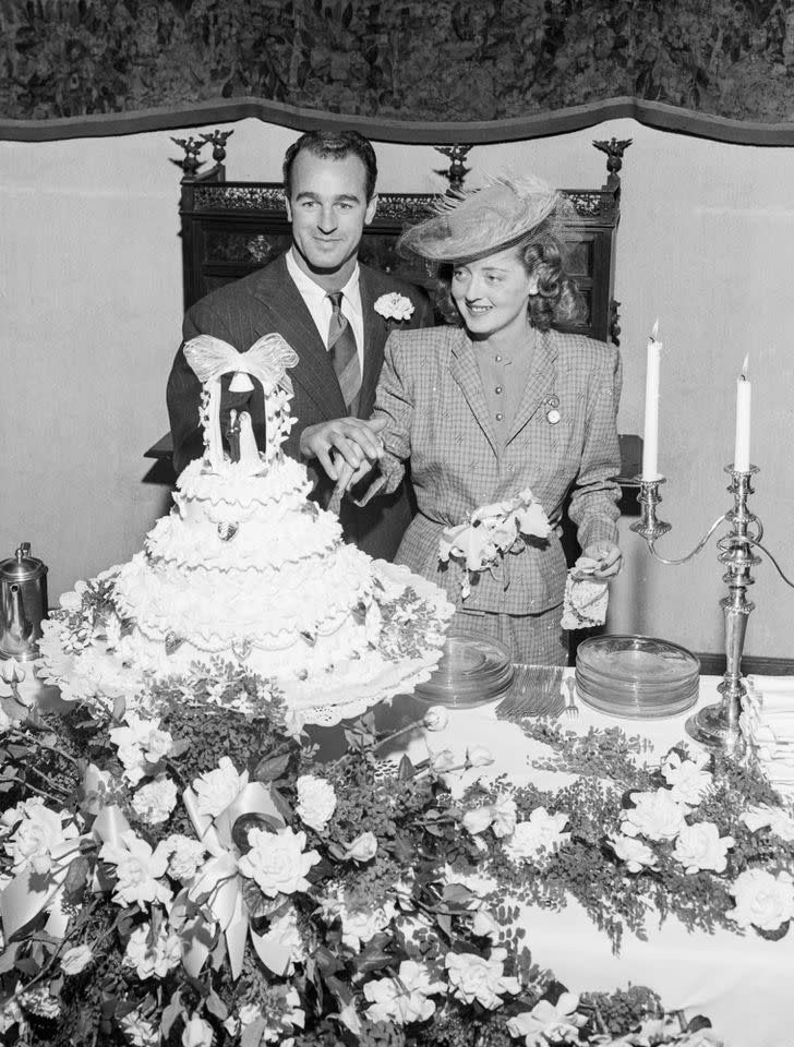 Bette Davis and William Grant Sherry cut their wedding cake on Nov. 30, 1945Credit: Bettmann Archive