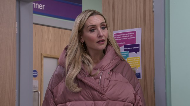 Eva Price standing in the doorway of a hospital in Coronation Street.