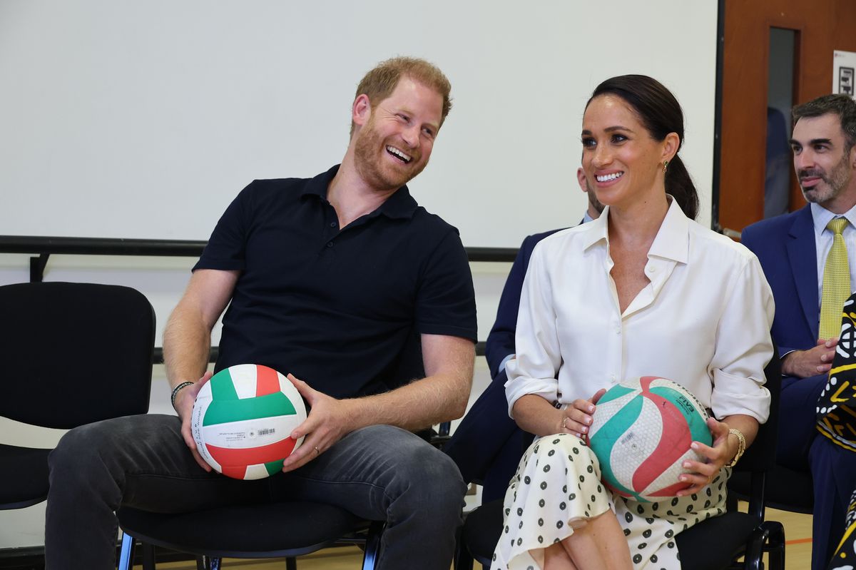 Prince Harry and Meghan Markle were all smiles as they met with athletes and veterans on day two of their Colombia tour