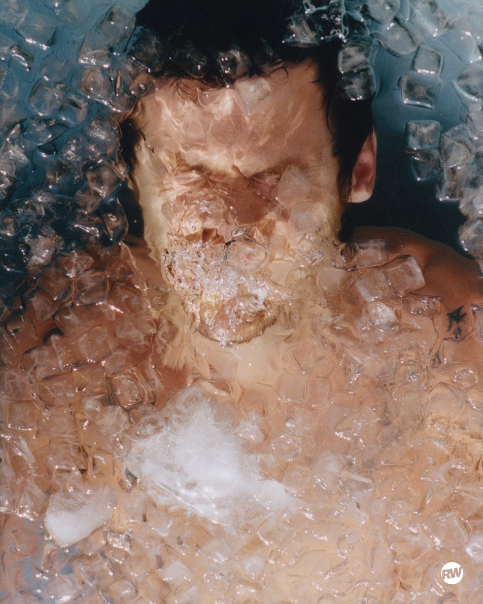 Person submerged in ice and foam. Person submerged in ice and foam.
