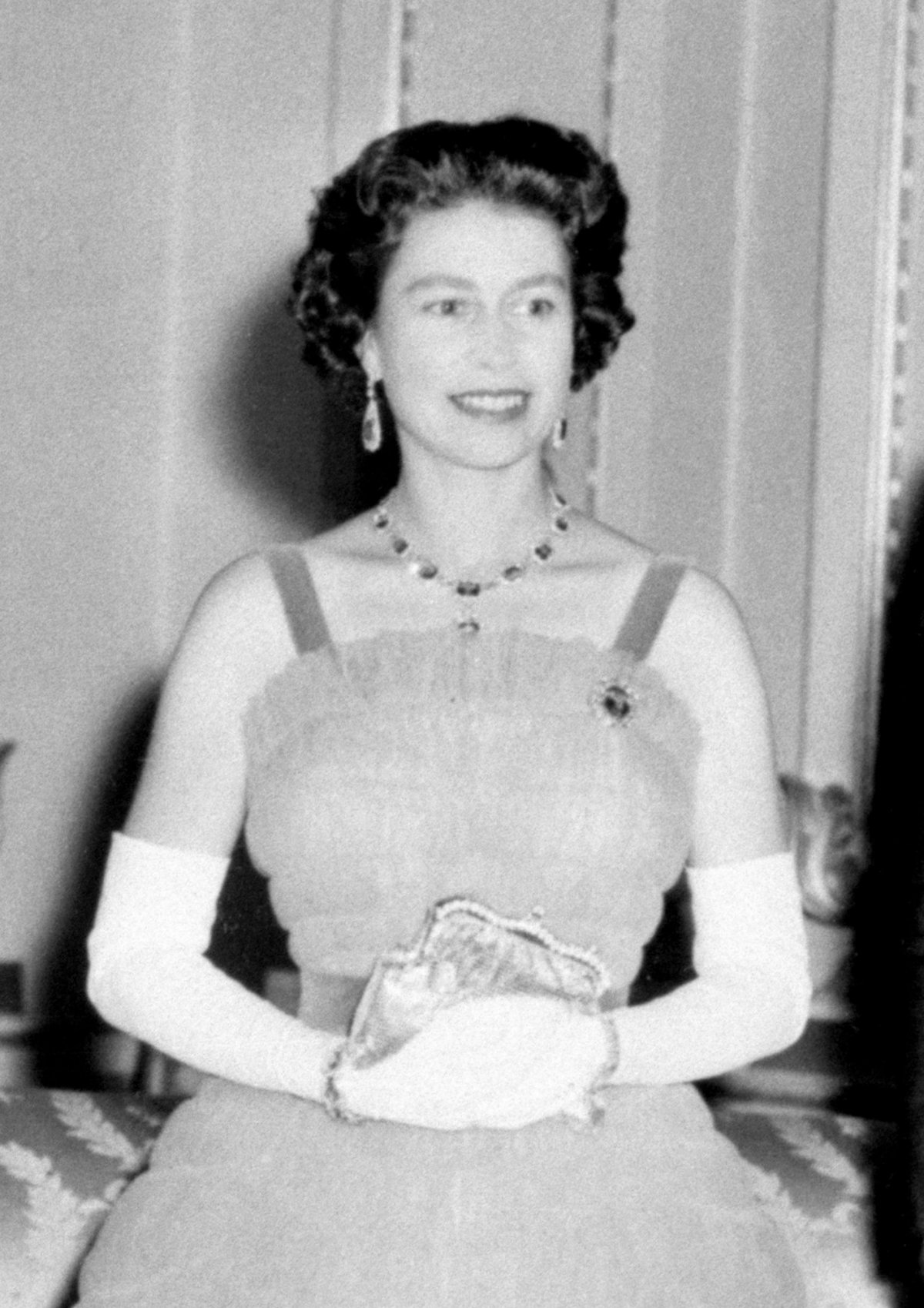 Queen Elizabeth II is pictured ahead of a dinner in honor of President and Mrs. Kennedy at Buckingham Palace in London on June 5, 1961 (PA Images/Alamy)