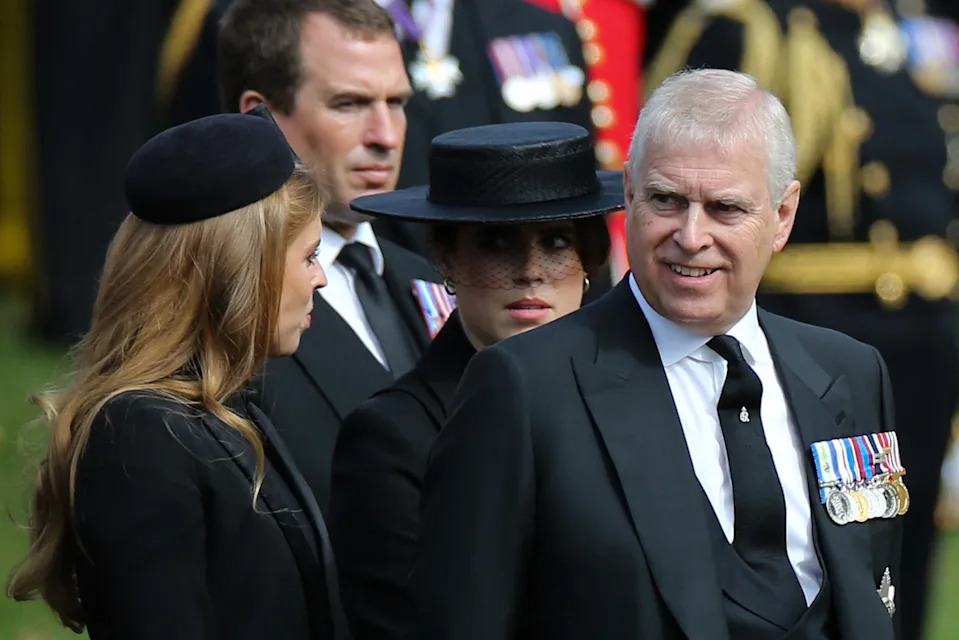 Princess Beatrice and Princess Eugenie dressed in black next to Andrew Mountbatten-Windsor at Queen Elizabeth's funeral