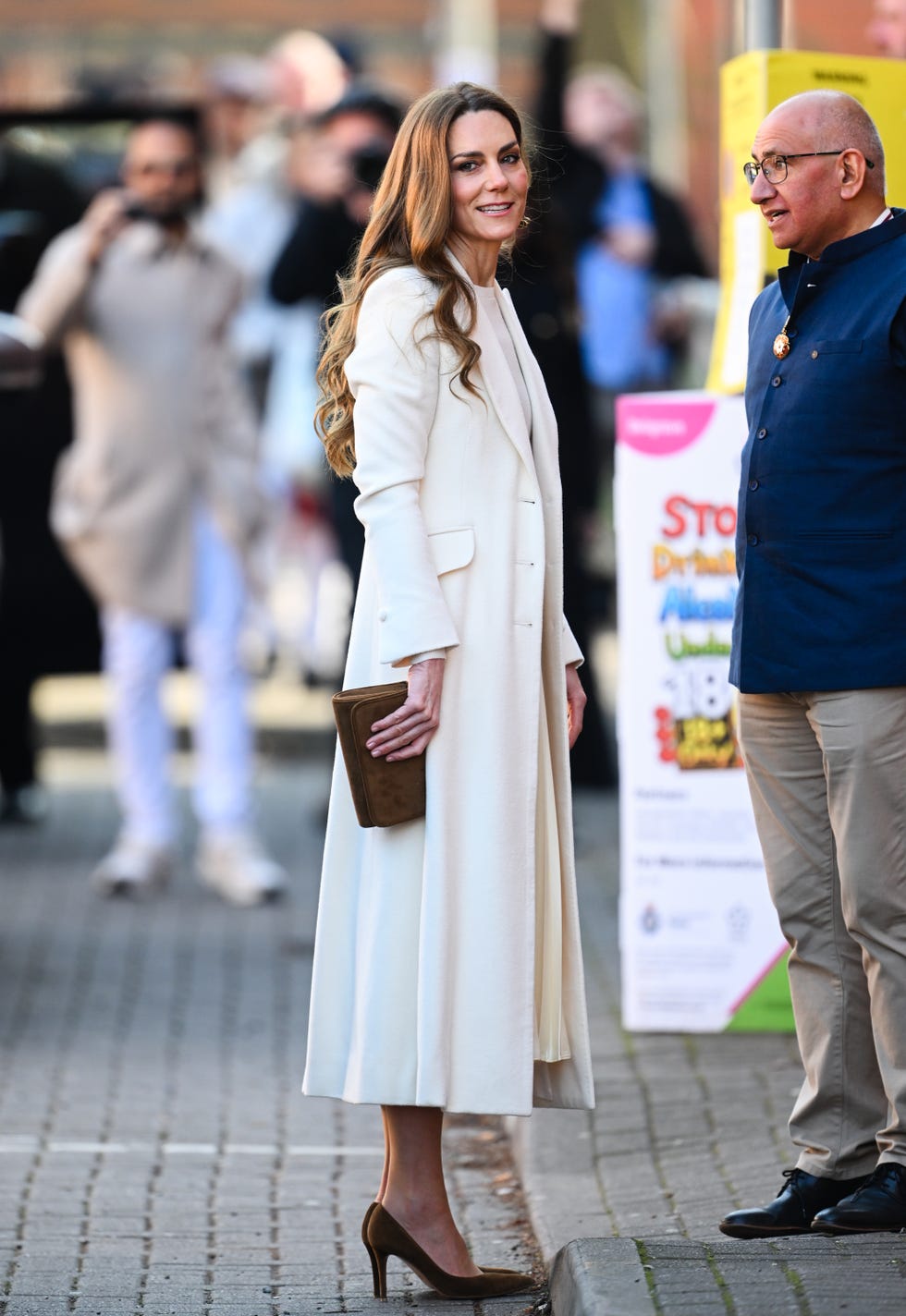 The Princess of Wales Visits Leicester wearing white dress and coat and brown heels and bag the princess of wales visits leicester wearing white dress and coat and brown heels and bag