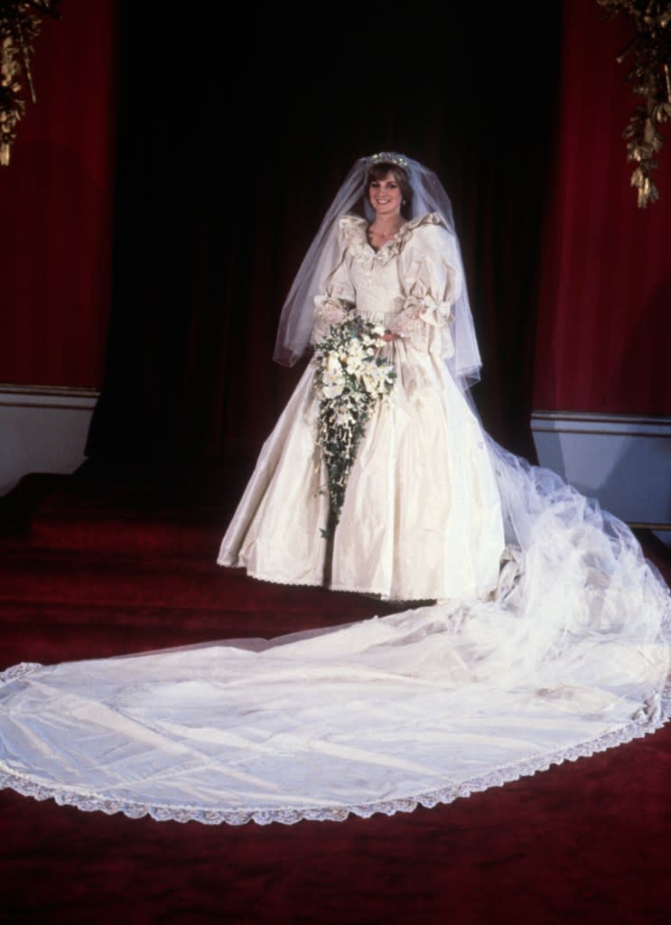 Princess Diana’s 1981 wedding gown was famous for its 25-foot train and voluminous sleeves. Corbis via Getty Images