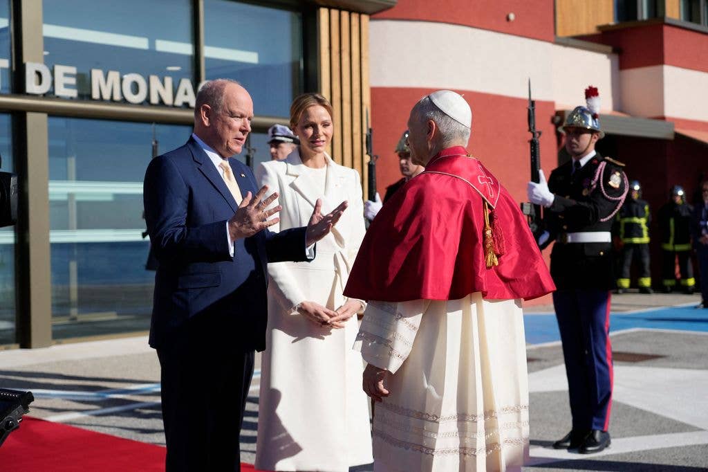 Prince Albert II of Monaco and Princess Charlene of Monaco welcome Pope Leo XIV on the tarmac of Monaco Heliport in Monte Carlo, Monaco