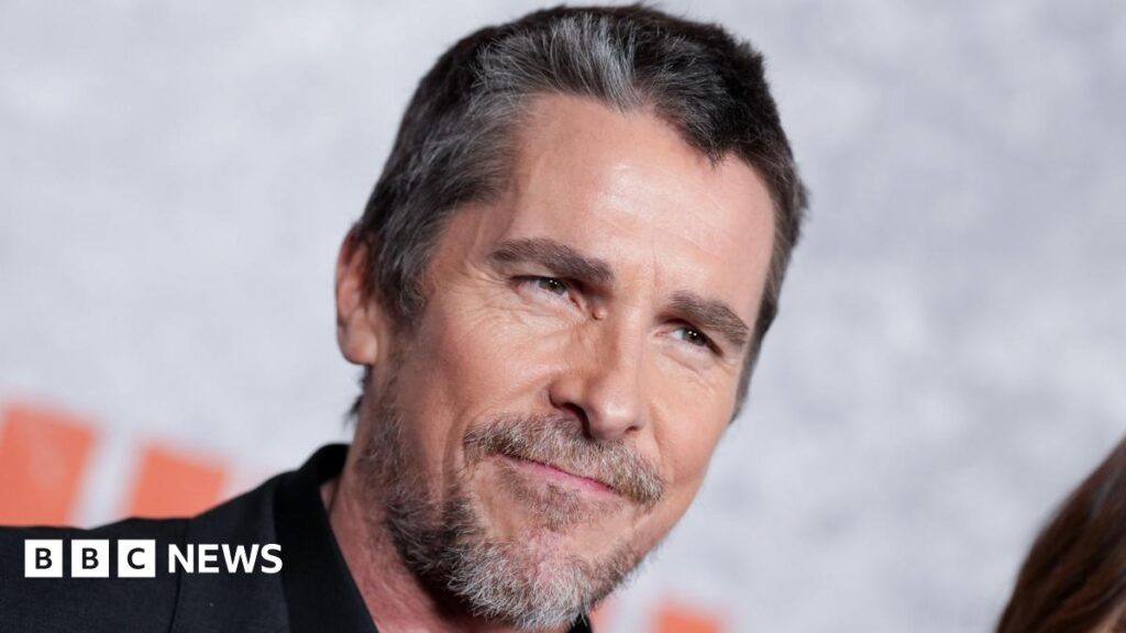Christian Bale’s role as Frankenstein’s monster in The Bride! inspired by Manic Street Preachers Headshot of Bale. He has greying black hair. He looks past the camera