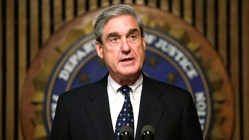 Robert Mueller speaking at FBI headquarters press conference in Washington, D.C.