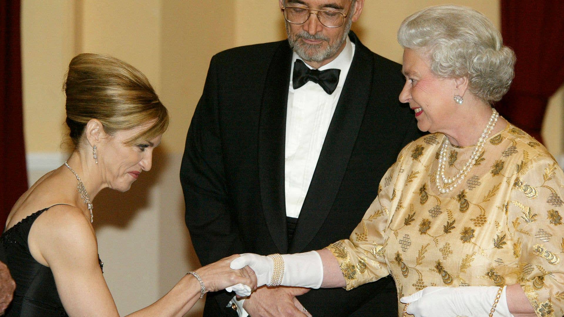 Madonna curtseying to the late Queen