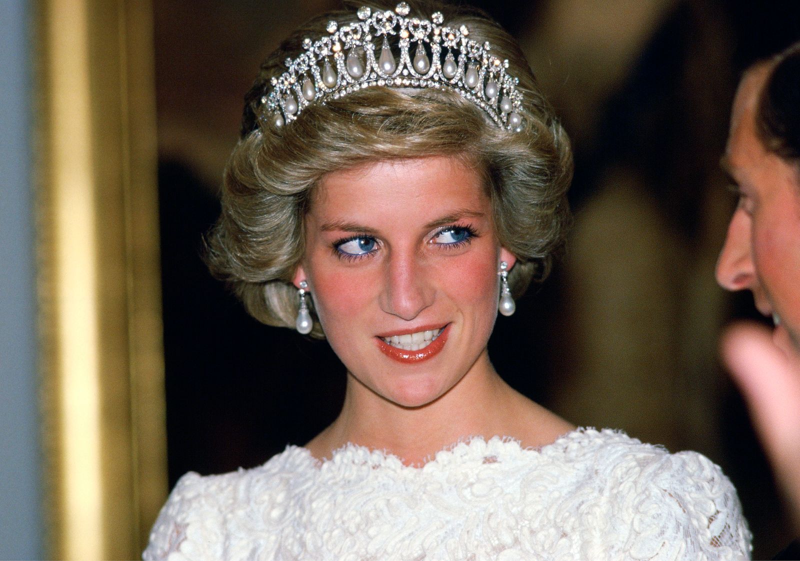 Princess Diana pictured in November 1985 wearing the Lover's Knot Tiara and the Collingwood earrings during a visit to...