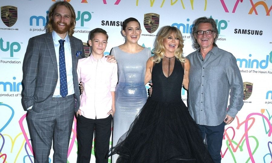 A family affair! Goldie Hawn had the support of her family on November 3 as she hosted "Goldie's Love In for Kids" event at Ron Burkle's Green Acres Estate in Beverly Hills. The Hollywood favorite was joined by her husband Kurt Russell and children: Wyatt Russell and Kate Hudson, along with Kate's son Ryder Robinson. The stylish family were caught laughing together as they posed for pictures on the carpet.
Goldie created The Hawn Foundation to help children discover the tools and skills to deal with high levels of stress and anxiety. The annual event helps raise money for the foundation and their MindUP program. Other stars in attendance included: Emily Ratajkowski, Josh Duhamel, Connie Britton, Melanie Griffith, Chelsea Handler, singer Colbie Caillat, tennis player Novak Djokovic, and <i>Barely Famous</i> sisters Erin and Sara Foster.
Photo: Steve Granitz/WireImage