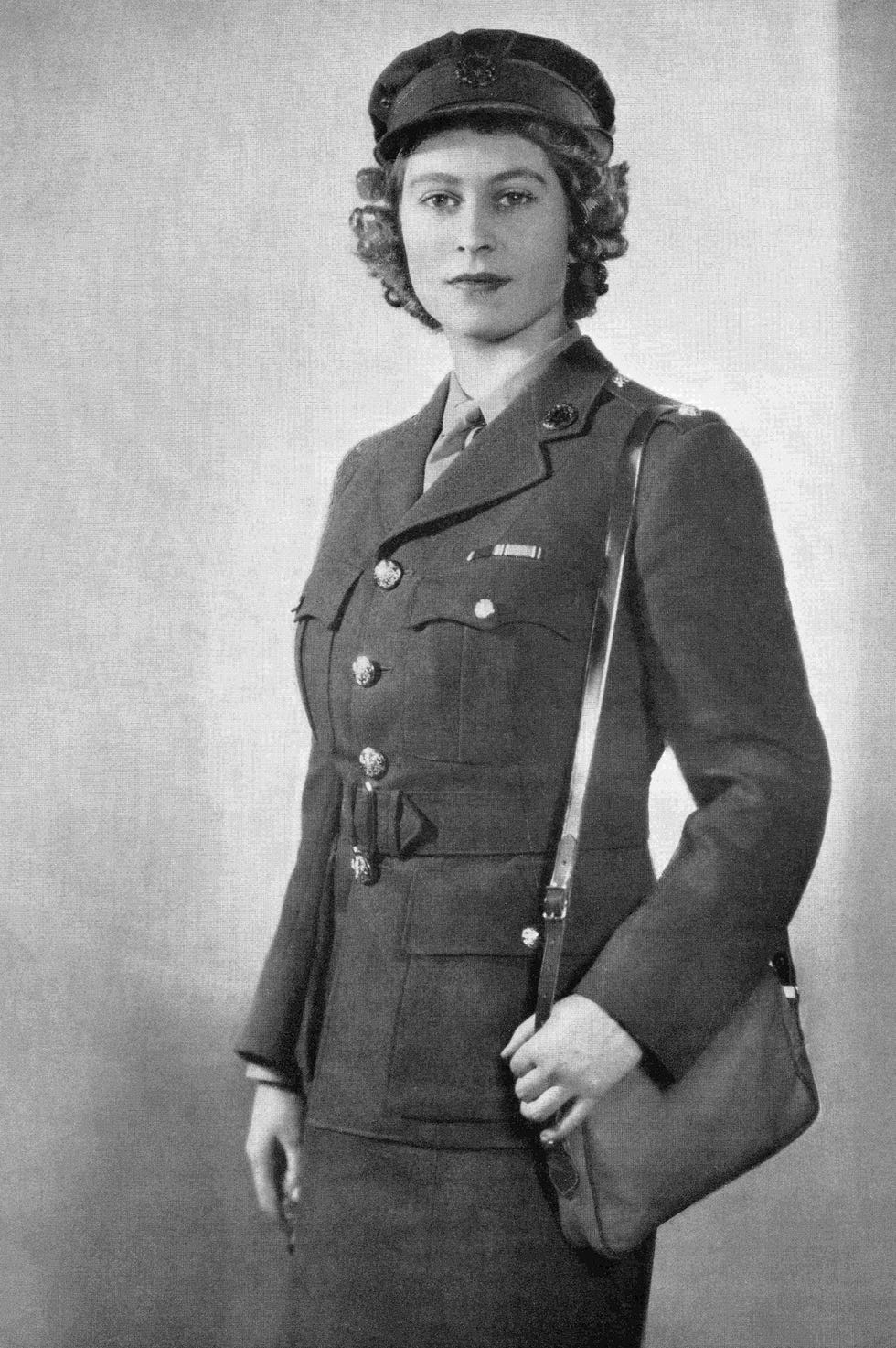 military uniformed individual with a bag