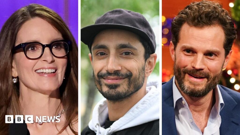 Headshots of Tina Fey - who is wearing a diamond necklace and black-rimmed glasses - Riz Ahmed - who is smiling and wearing a white hoodie and black cap - and Jamie Dornan who is wearing a blue shirt and suit jacket.