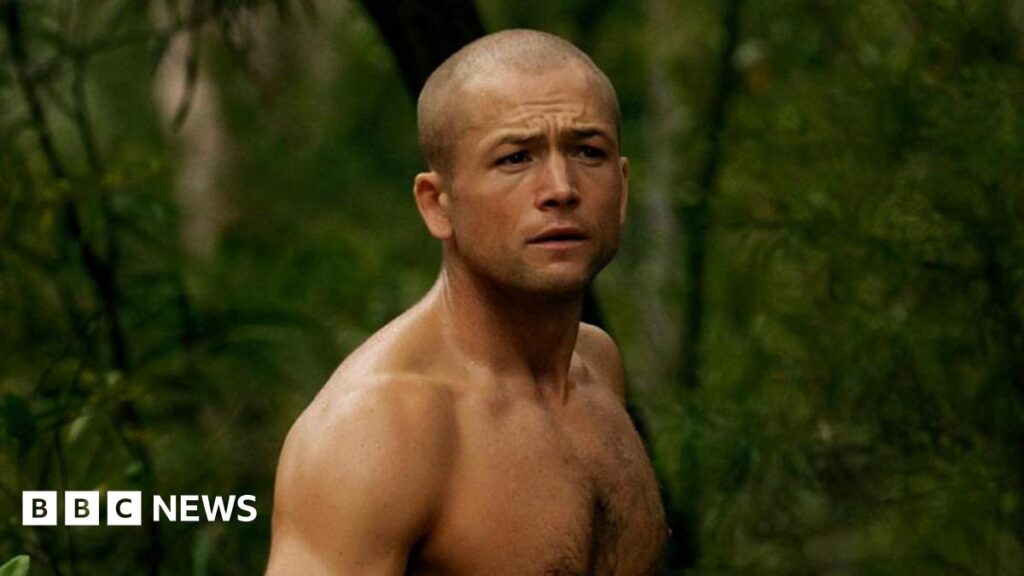 Taron Egerton to star in Netflix thriller Apex with Charlize Theron Egerton topless in a forest. He also ahs a shaved head