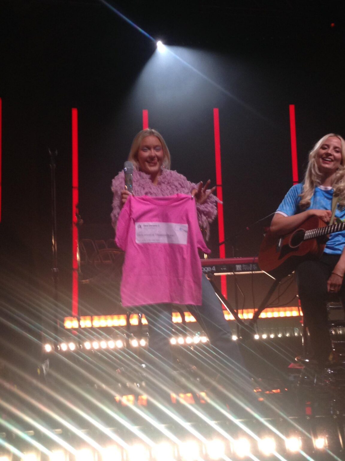 Zara Larsson posing with a shirt that has her 2016 tweet “Chris Brown is TRAAASSHHHHH” printed on it. It was gifted by a fan.
