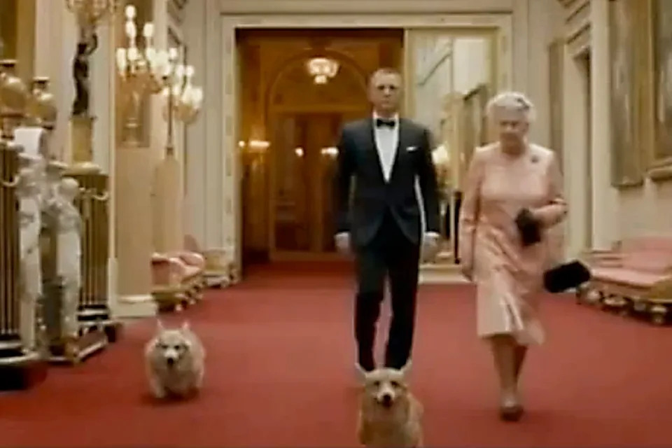 Daniel Craig’s James Bond joins Queen Elizabeth II and her beloved corgis for an Olympic stroll in 2012.