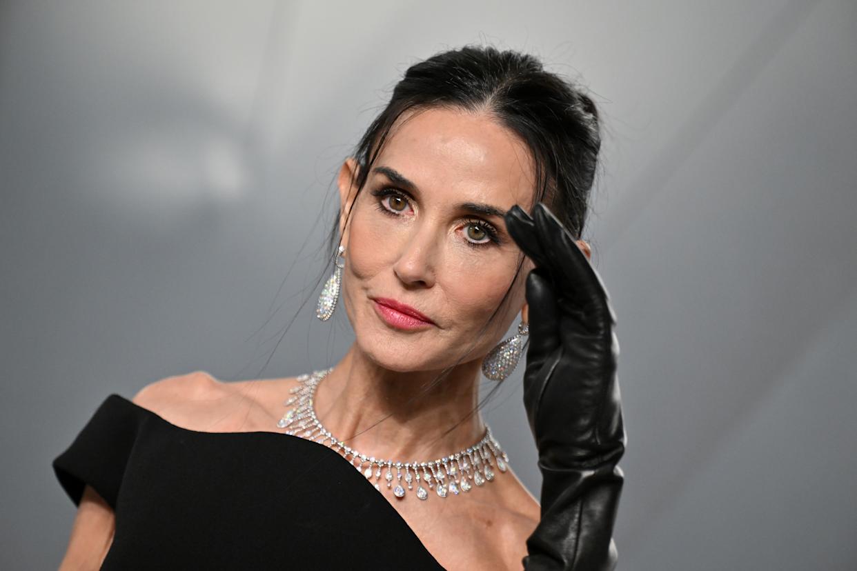 The photos made their way to social media, where they were scrutizined. Demi Moore is pictured at the fête above. Getty Images