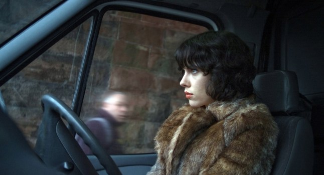 Film: 'Under the Skin' (2013) starring actress Scarlett Johansson as The female Scarlett Johansson goes alien and prowls the streets of Glasgow in a fur coat luring unsuspecting men to their doom in this strange marriage of science fiction and horror. High on atmosphere if a touch opaque of plot, it won director Jonathan Glazer (Sexy Beast) high praise from the critics and a bag of award nominations the world over. No Merchandising. Editorial Use Only. No Book Cover Usage Mandatory Credit: Photo by C./Everett/REX Shutterstock (3686173c) Under the Skin, Scarlett Johansson Under the Skin - 2014