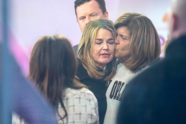 Savannah Guthrie gets a kiss form Hoda Kotb during a visit to the Today show at Rockefeller Plaza on Thursday, March 5, 2026, in New York. (Photo by Charles Sykes/Invision/AP)