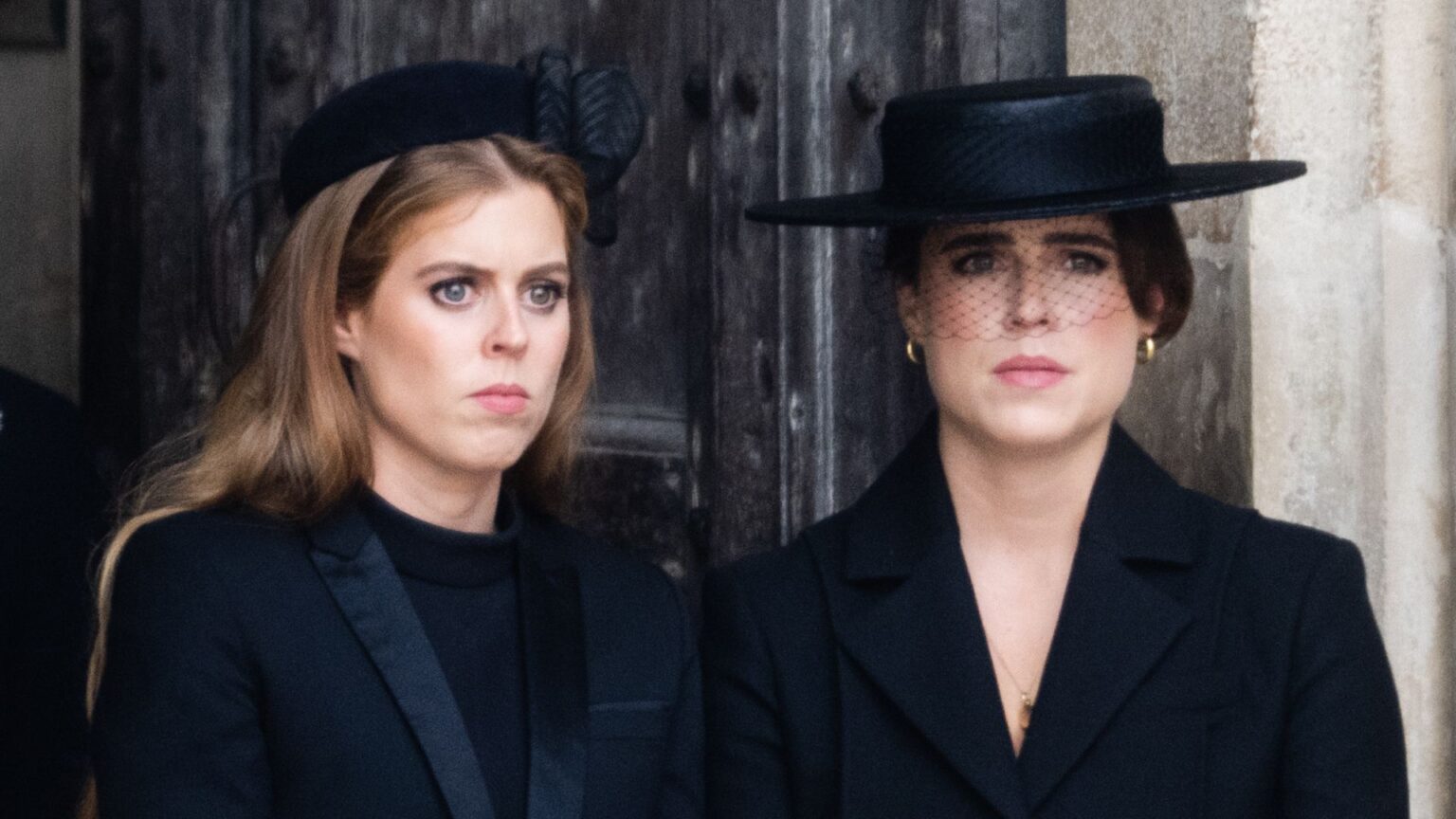 Princess Beatrice and Princess Eugenie both look sad while wearing black outfits
