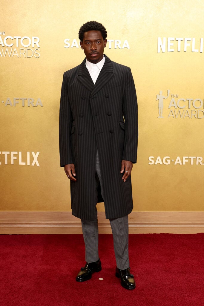Damson Idris Prada Actor Awards 2026, Prada tailored suit, menswear red carpet 2026, Damson Idris style, black formalwear, sharp tailoring, modern menswear