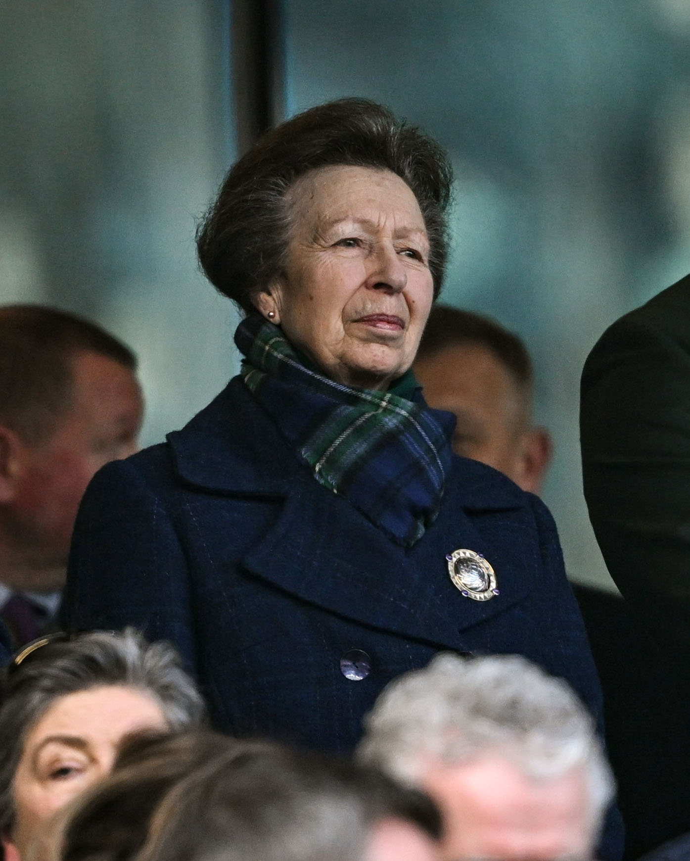 Princess Anne wearing a tartan scarf and blue coat